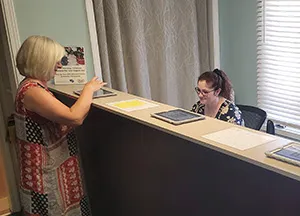 Chiropractic Pooler GA Application Process Patient checking in at the front desk.