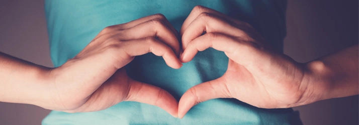 Chiropractic Pooler GA Heart Hands Person making heart hands over their stomach.