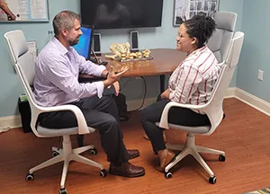 Chiropractor Pooler GA Steve Ranicki Patient Consultation Dr. Steve Ranicki consulting with a patient.